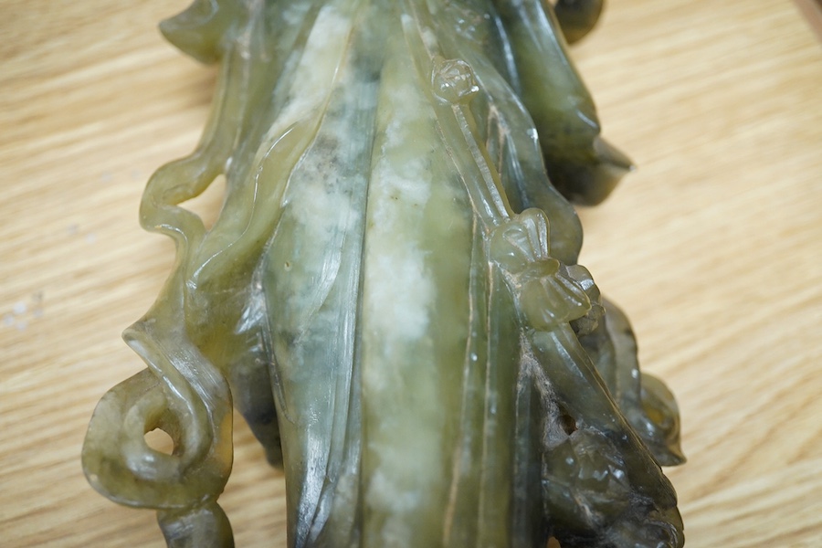 A Chinese carved green soapstone figure of Guanyin, 34cm high. Condition - fair to good